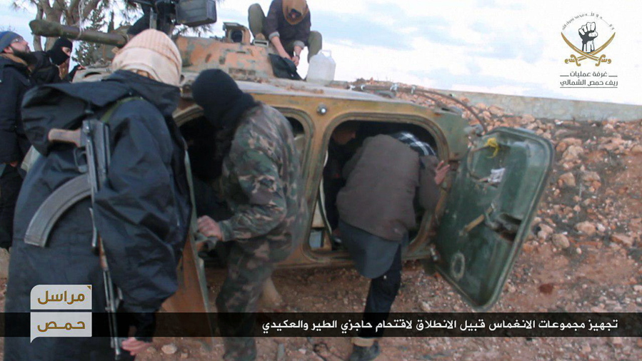 This photo released online on Thursday, Feb. 9, 2017, by the website of the al-Qaida-linked Fatah al-Sham, an anti-government militant group, shows fighters from the al-Qaida-linked Fatah al-Sham Front, preparing to attack government checkpoints in the Homs province, Syria. The war&#039;s January toll ??? some 2,000 dead, about a third of them civilians, according to the Britain-based Syrian Observatory for Human Rights monitoring group ??? is the lowest it has been in four years, but that may be because the government wrapped up operations for Aleppo, the country&#039;s largest city, last year.