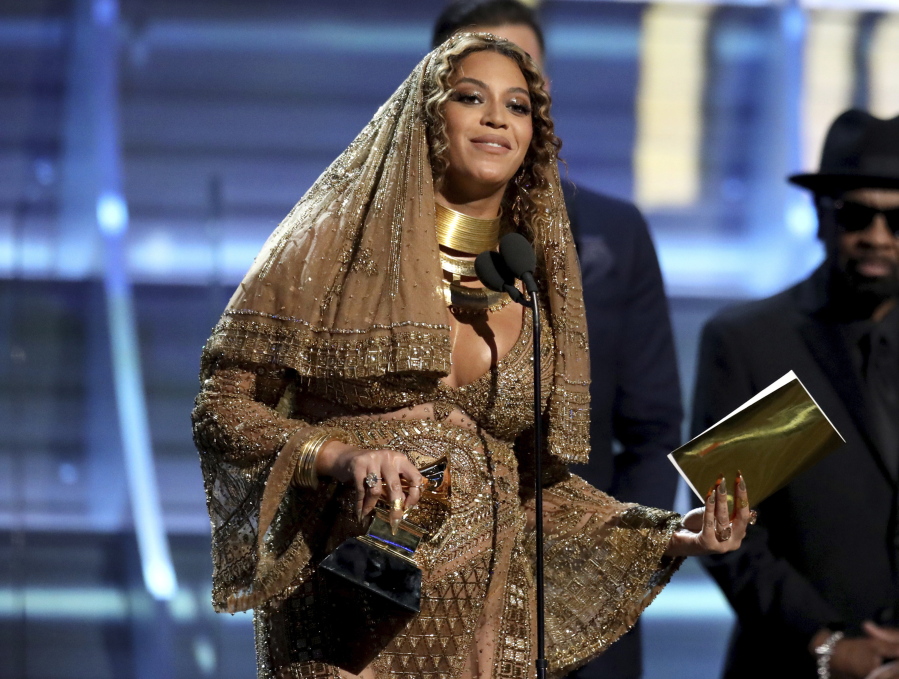 Beyonce accepts the award for best urban contemporary album for &quot;Lemonade&quot; at the 59th annual Grammy Awards on Sunday in Los Angeles.