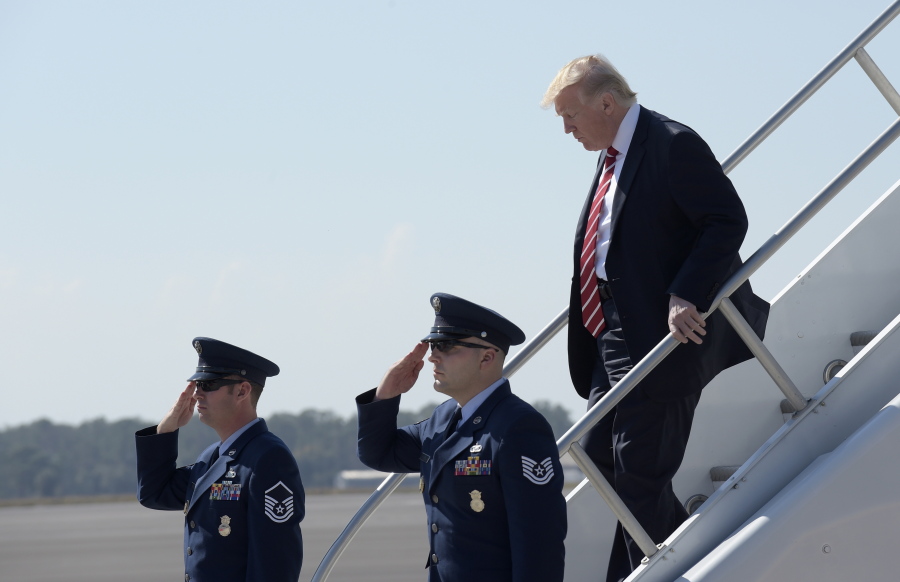 President Donald Trump walks down the steps of Air Force One at MacDill Air Force Base in Tampa, Fla., on Monday for a visit to the headquarters for U.S. Central Command and U.S. Special Operations Command at before returning to Washington.