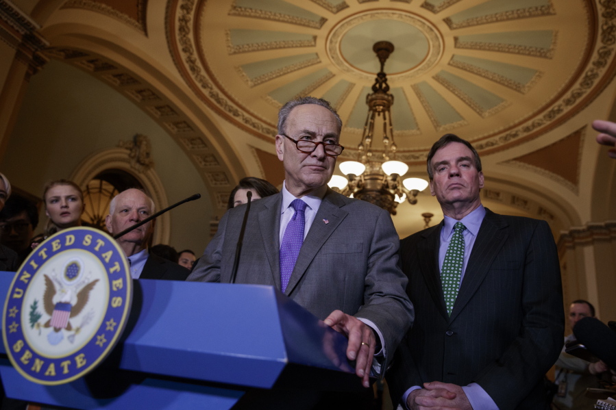 Senate Minority Leader Chuck Schumer, D-N.Y., joined by Sen. Ben Cardin, D-Md., left, and Sen. Mark Warner, D-Va., right, calls for an investigation into President Donald Trump&#039;s administration over its relationship with Russia on Wednesday at a news conference on Capitol Hill. (j.