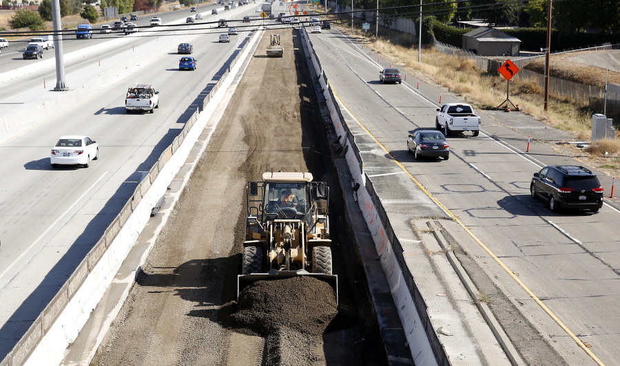 Vehicles pass a highway construction site on Interstate 80 in Sacramento, Calif.