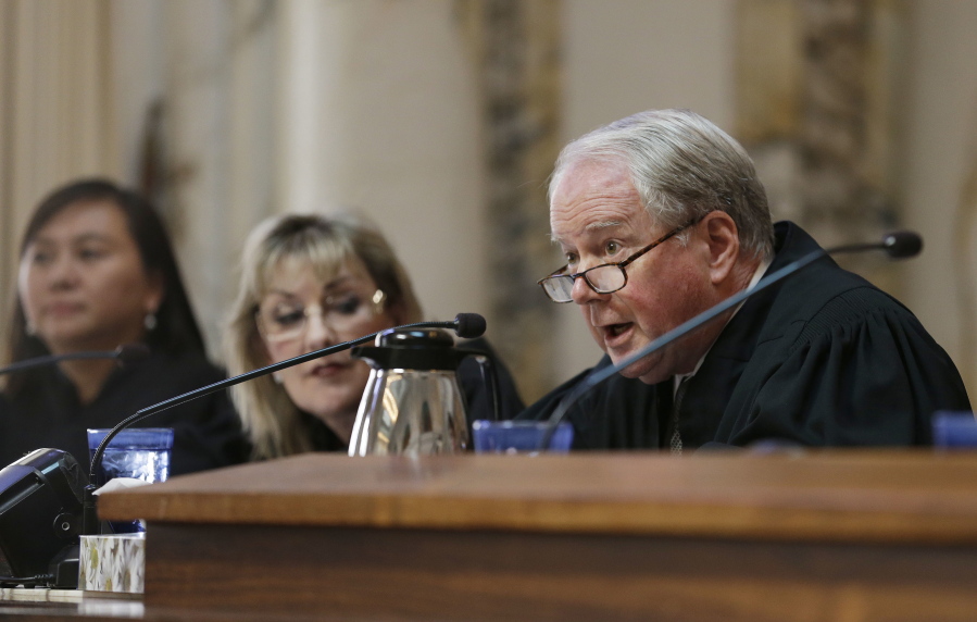 Circuit Judge William A. Fletcher, right, questions Asst. U.S. Atty. Merry Chan about Barry Bonds&#039; conviction before an 11-judge panel of the 9th U.S. Circuit Court of Appeals in San Francisco in 2014. The federal appellate court is hearing arguments whether to reinstate President Donald Trump&#039;s immigration travel ban.