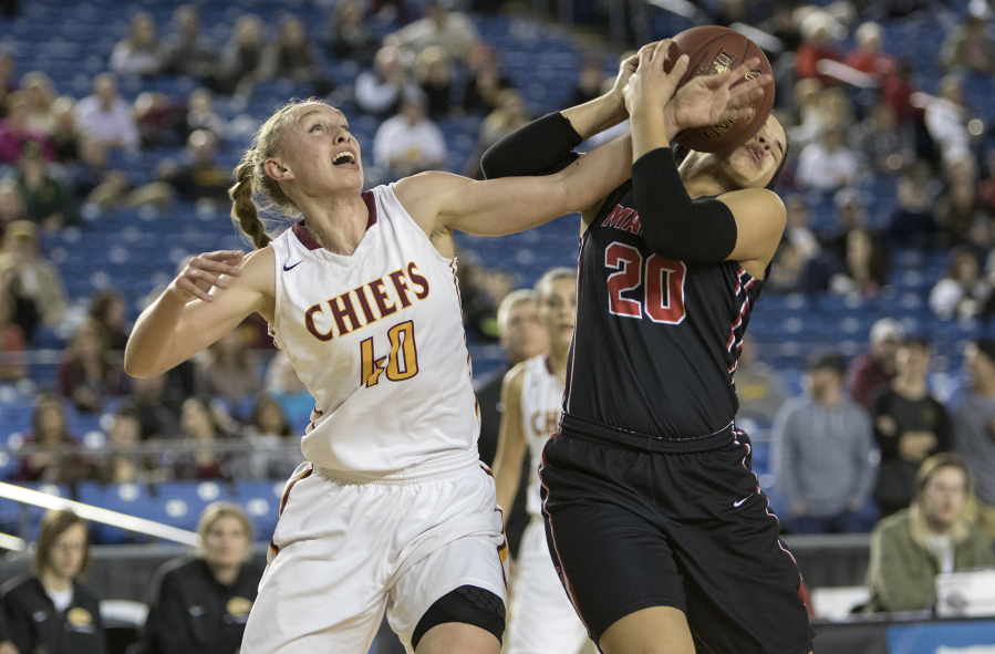 Camas' Maggie Wells, right, battles for a rebound with Moses Lake's Abby Rathbun Thursday, March 2, 2017, during the quarterfinals of the 4A Girls State Basketball Tournament in Tacoma, Wash.