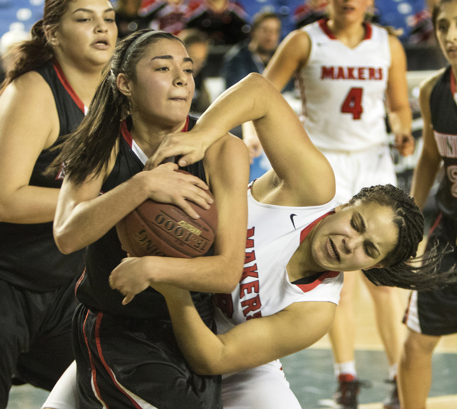 Camas&#039; Maggie Wells, right, battles for a rebound with Sunnyside&#039;s Ashlee Maldonado Friday, March 3, 2017, during consolation play at the 4A Girls State Basketball Tournament in Tacoma, Wash. The action ended in a jump ball.