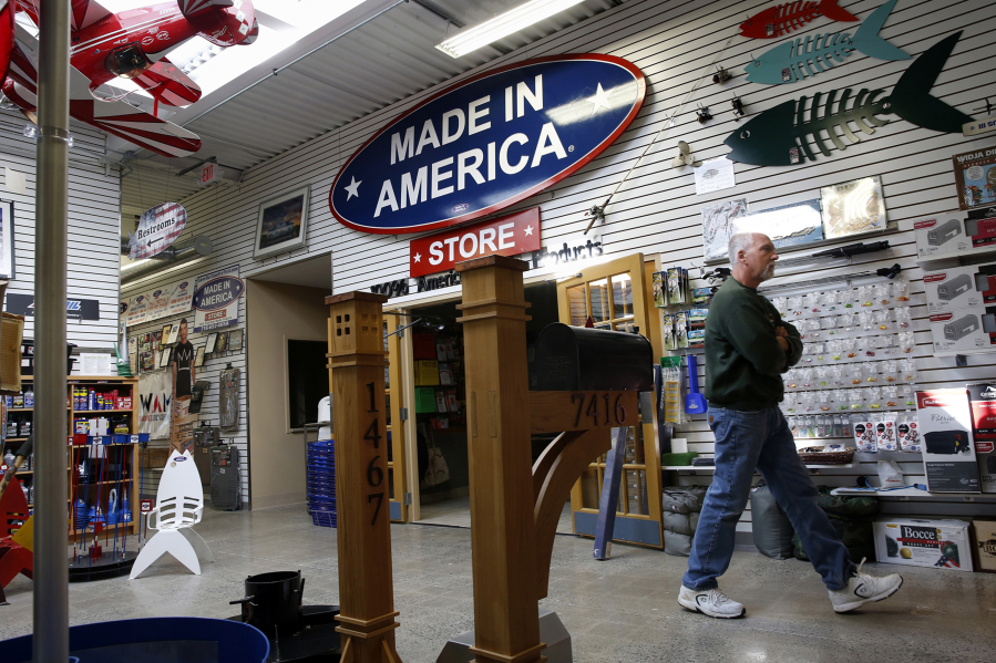Mark Andol, owner and creator of the Made in America store located in Elma, N.Y., walks through the store on March 2.
