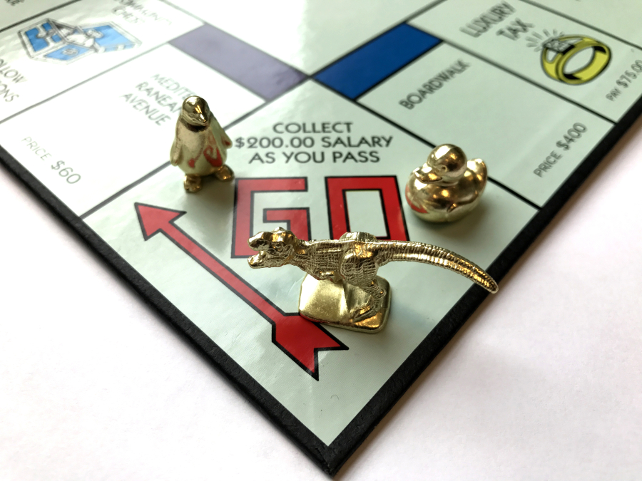 Fans of the game Monopoly voted to replace three of the eight tokens in 2017. The new tokens are, from left, a penguin, a T. rex and a duck.