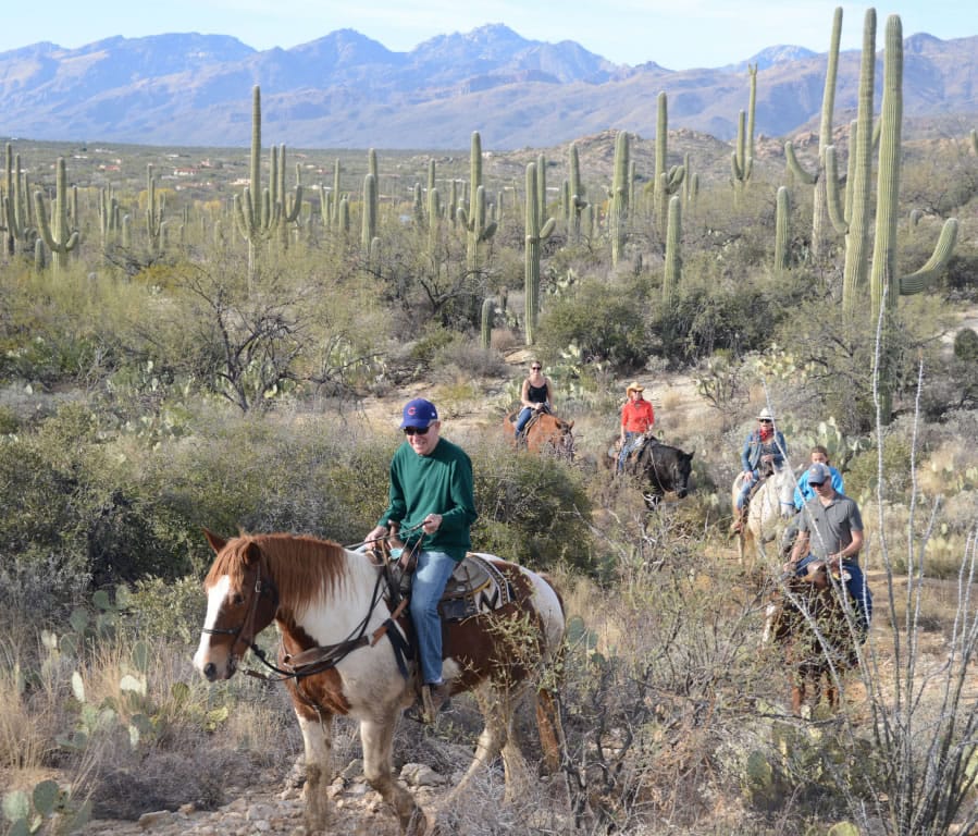 The writer&#039;s dad, George Fink, leads the pack on a family trail ride through the desert.