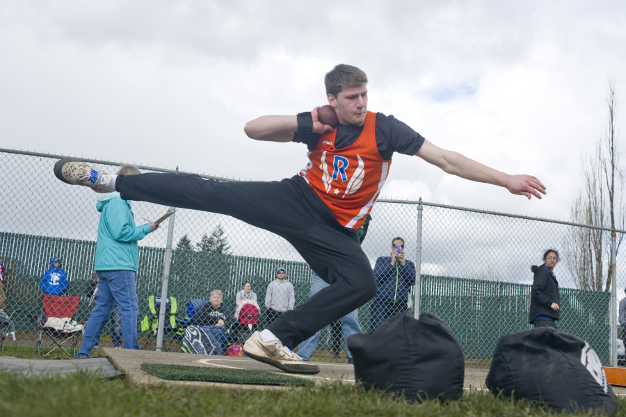 Ridgefield freshman Trey Knight winds up to throw the shot put while competing in the Tiger Invite at Battle Ground High School.