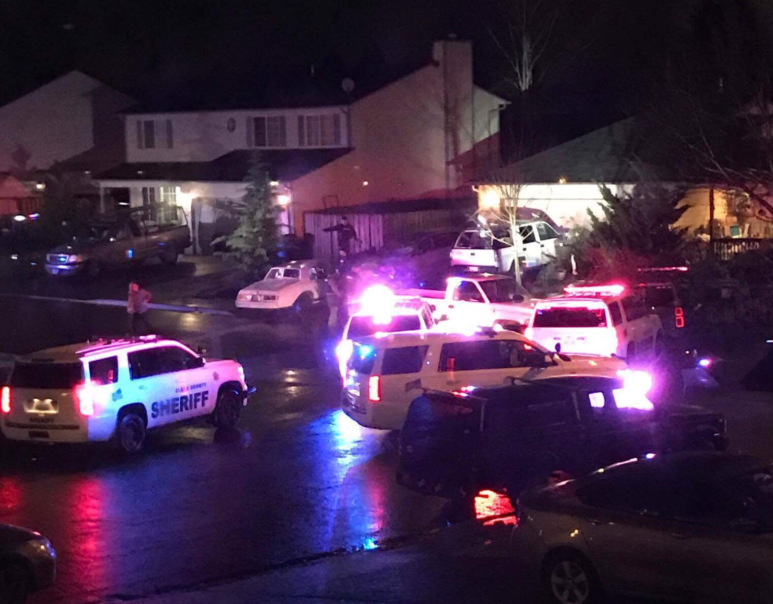 Law enforcement officials respond Thursday evening to the 13400 block of Northeast 97th Street, in the Orchards area, following a report of a man behaving erratically. The man was taken into custody after about an hour and an ample police response, according to emergency radio traffic monitored at The Columbian.