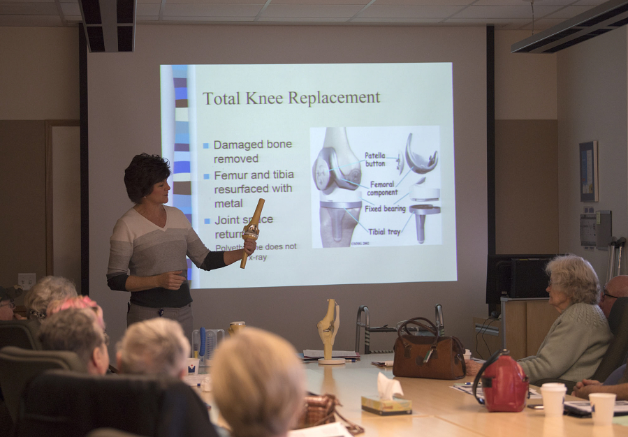 Wendi Walter, total joint program coordinator and licensed physical therapist assistant, leads a March 14 class on total-knee replacement surgery at Legacy Salmon Creek Medical Center. The hospital began in January offering a robotic-assisted version of the procedure using MAKOplasty technology. Surgeons have performed more than 15 of the procedures to date.