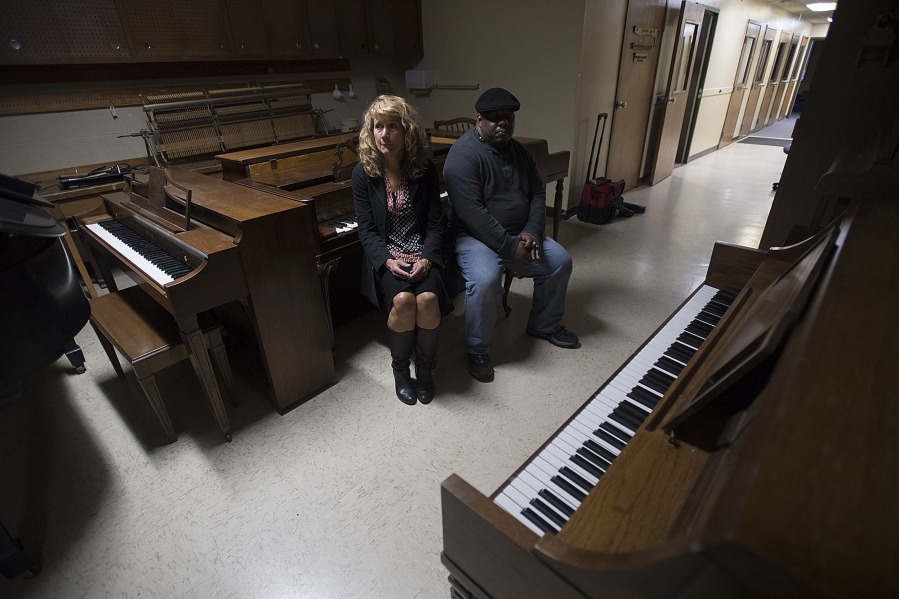 Surrounded by pianos, executive director Cheri Martin, left, and head piano technician and instructor Leal Sylvester discuss the fate of the School of Piano Technology for the Blind on Thursday afternoon. The school does good business in piano repairs and sales, but it&#039;s completely out of students, Martin said.