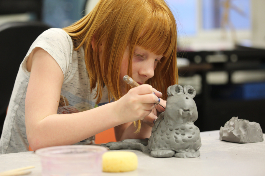 Union Ridge Elementary School third-grader Ella Rupp, 8, sculpts a monster in class during the Ridgefield Youth Arts Month Program, which allows students to try out different arts in mostly free classes.