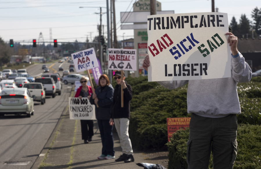Alden Bice, who recently retired from a career in health care, joined other protesters across Clark County on Sunday who rallied to show support for the Affordable Care Act.