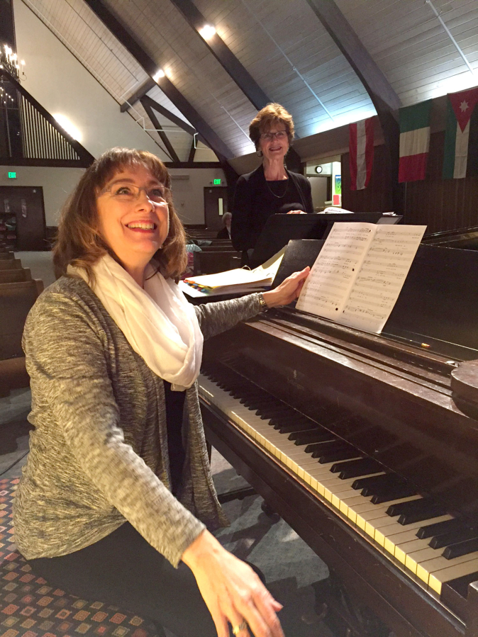 Reprise choir co-directors April Duvic, left, and Janet Reiter.