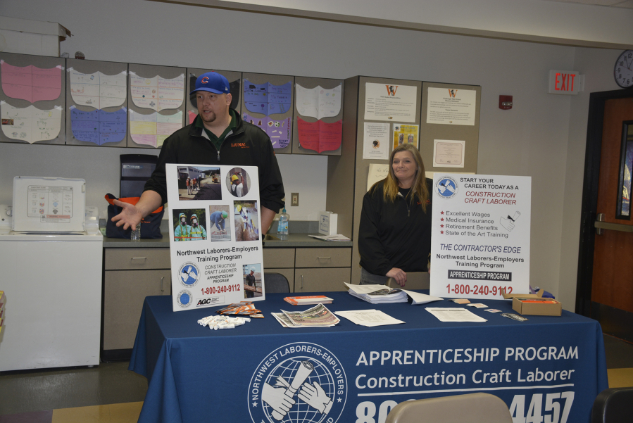 Washougal: Deken Letinich, field representative from the Washington and Northern Idaho District Council of Laborers, mans a booth at Washougal High School&#039;s Post High School Career Options Fair on Feb.