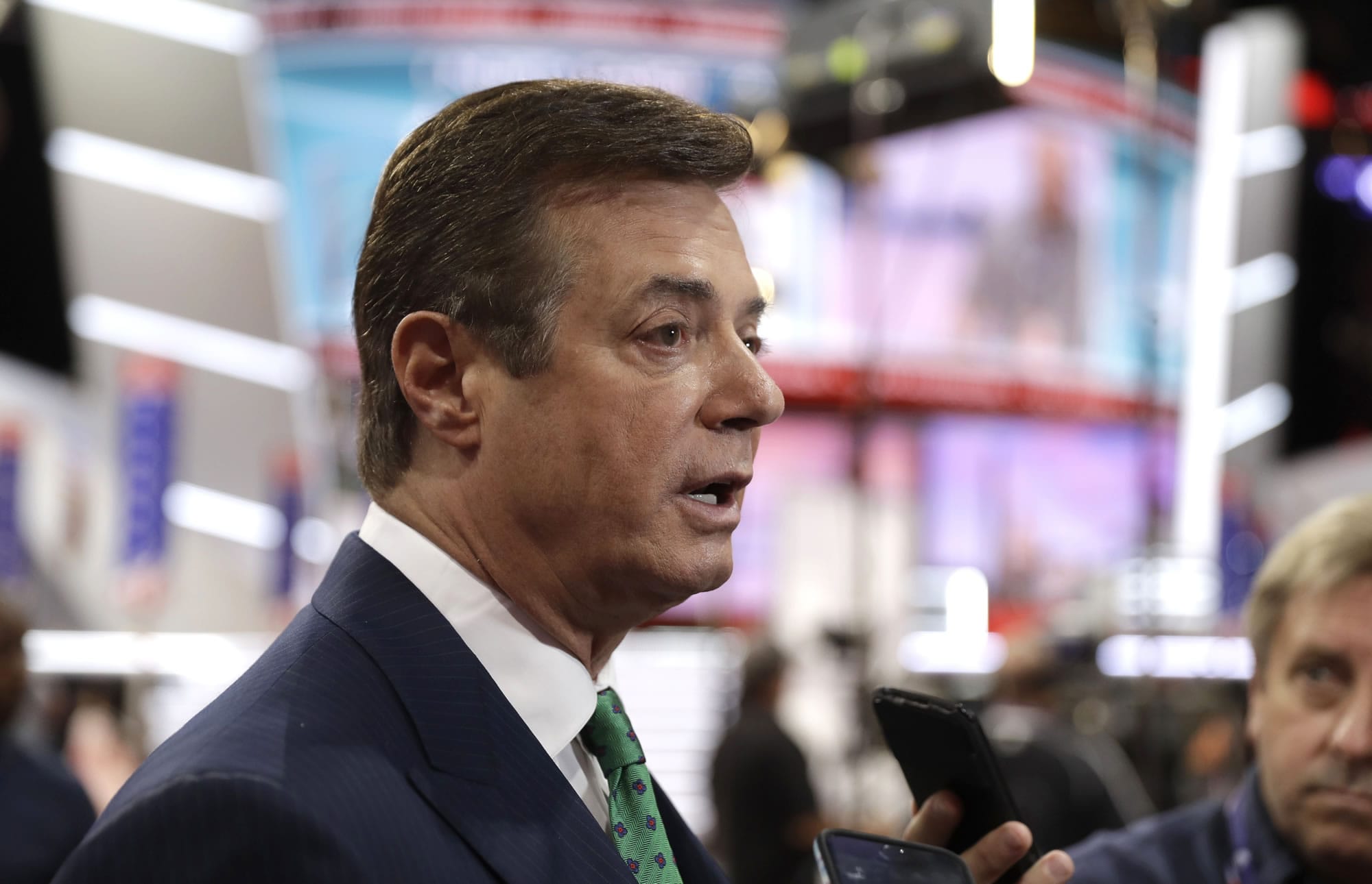 FILE  - In this July 17, 2016, file photo, then-Trump campaign chairman Paul Manafort talks to reporters on the floor of the Republican National Convention in Cleveland. U.S. Treasury Department agents have recently obtained information about offshore financial transactions involving Manafort, as part of a federal anti-corruption probe into his work in Eastern Europe, The Associated Press has learned.