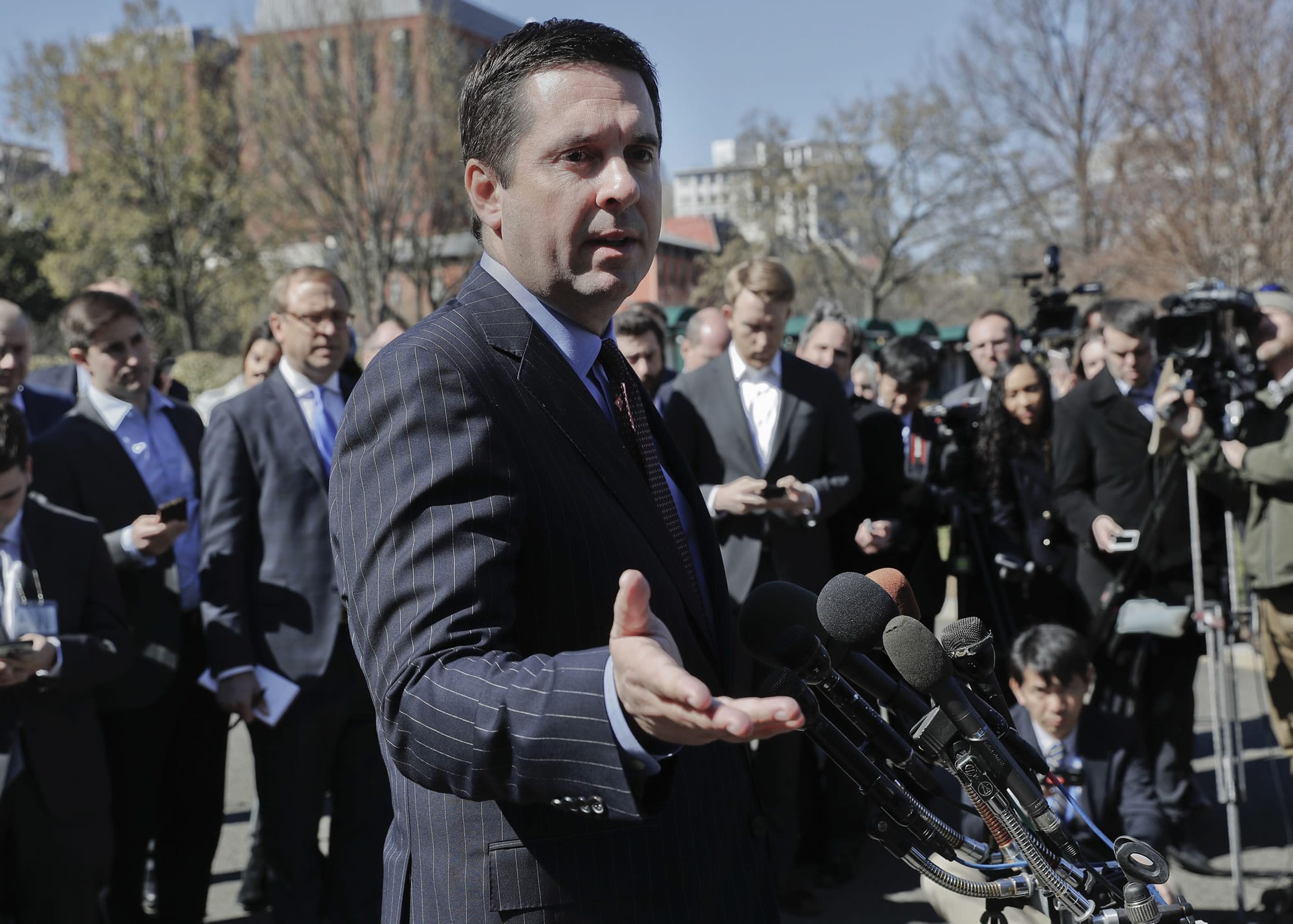 FILE - In this March 22, 2017 file photo, House Intelligence Committee Chairman Rep. Devin Nunes, R-Calif, speaks with reporters outside the White House in Washington following a meeting with President Donald Trump. Nunes’ spokesman says the congressman met on the White House grounds with the source of the claim that communications involving President Donald Trump’s associates were caught up in “incidental” surveillance.