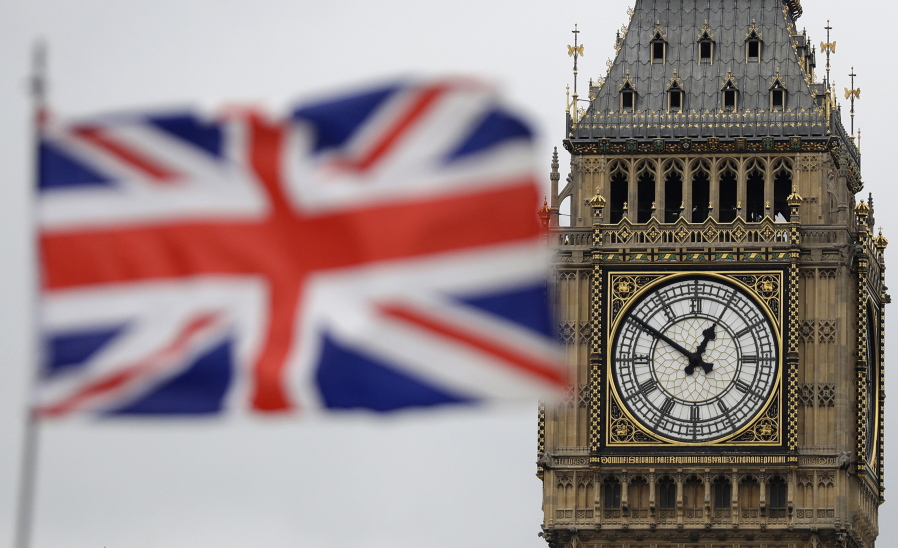 British Union flag waves in front of the Elizabeth Tower at Houses of Parliament containing the bell know as &quot;Big Ben&quot; in central London, Wednesday, March 29, 2017. Britain will begin divorce proceedings from the European Union later on March 29, starting the clock on two years of intense political and economic negotiations that will fundamentally change both the nation and its European neighbors.