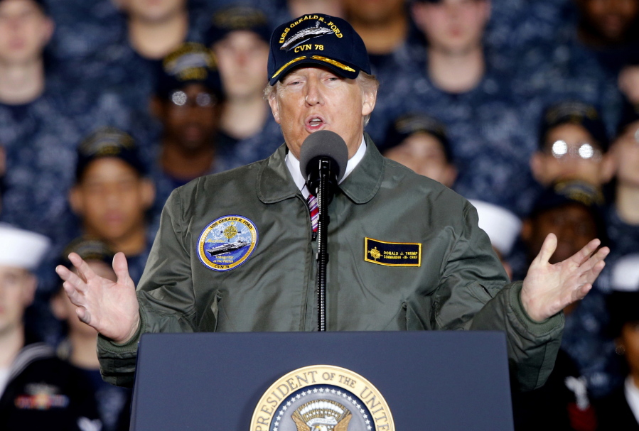 President Donald Trump gestures as he speaks to Navy and shipyard personnel March 2 in Newport News, Va. The ongoing stories of ties between President Donald Trump and Russian officials have challenged, amused, angered and inspired spy novelists.