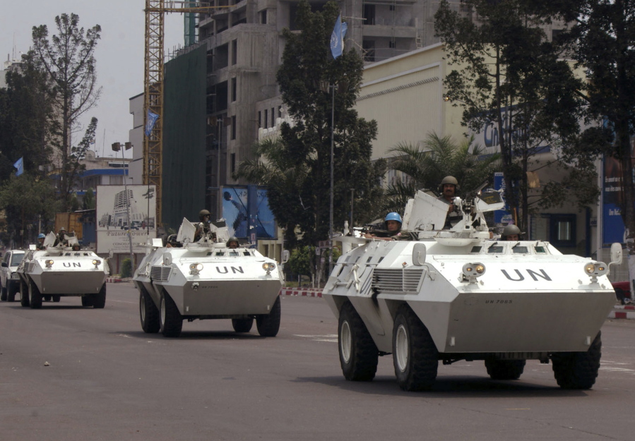 U.N. troops in armored vehicles drive through the streets of Kinshasa, Congo. The United Nations deployed Uruguayan and Tanzanian peacekeepers on a search-and-rescue mission two weeks ago.