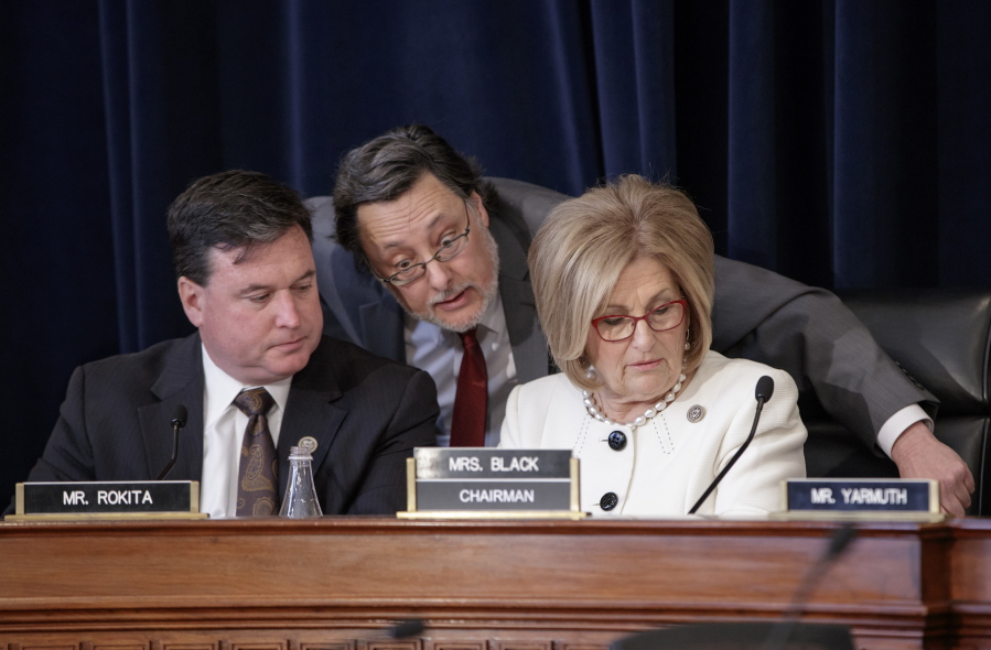 House Budget Committee Chair Diane Black, R-Tenn., right, joined at left by Rep. Todd Rokita, R-Ind., and panel staff member Jim Bates, center, works on the Republican health care bill Thursday on Capitol Hill. (j.