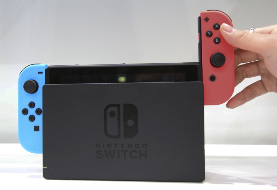 Nintendo&#039;s new Switch gaming system is aimed at video gamers who like to play both at home and on the road --converting to a tablet-sized portable device.