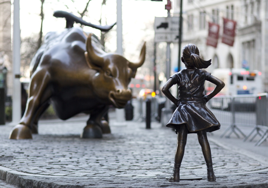 The Charging Bull and Fearless Girl statues are sit on Lower Broadway in New York.