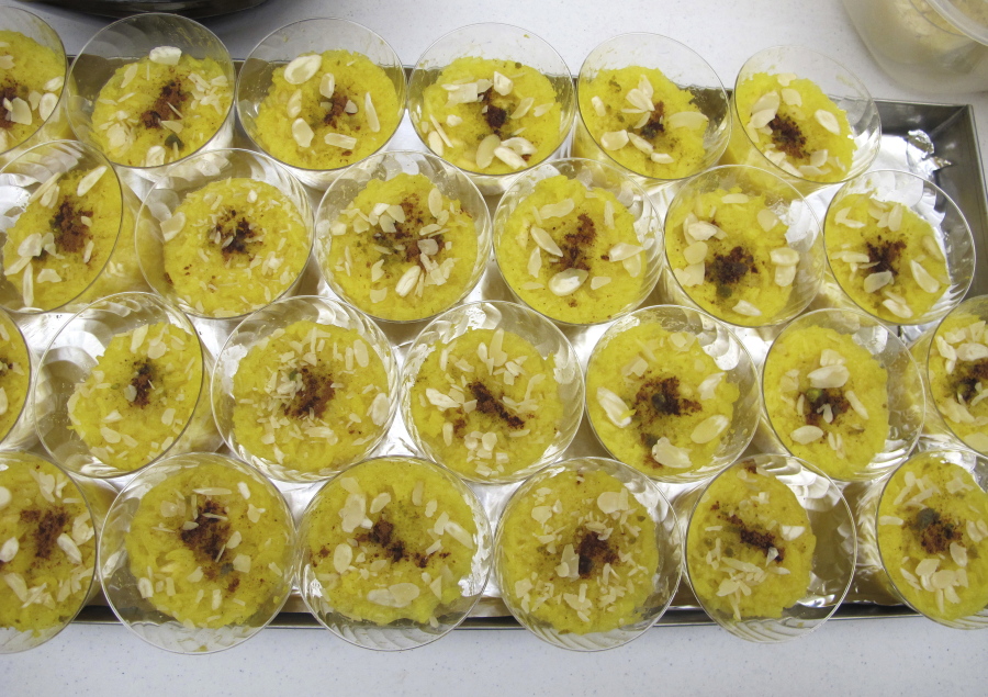 Containers of saffron rice pudding sit together during a University of Vermont workshop, in Burlington, Vt. The university researchers have been raising the exotic spice now grown primarily in Iran and are encouraging growers to tap into what they hope will be a cash crop.