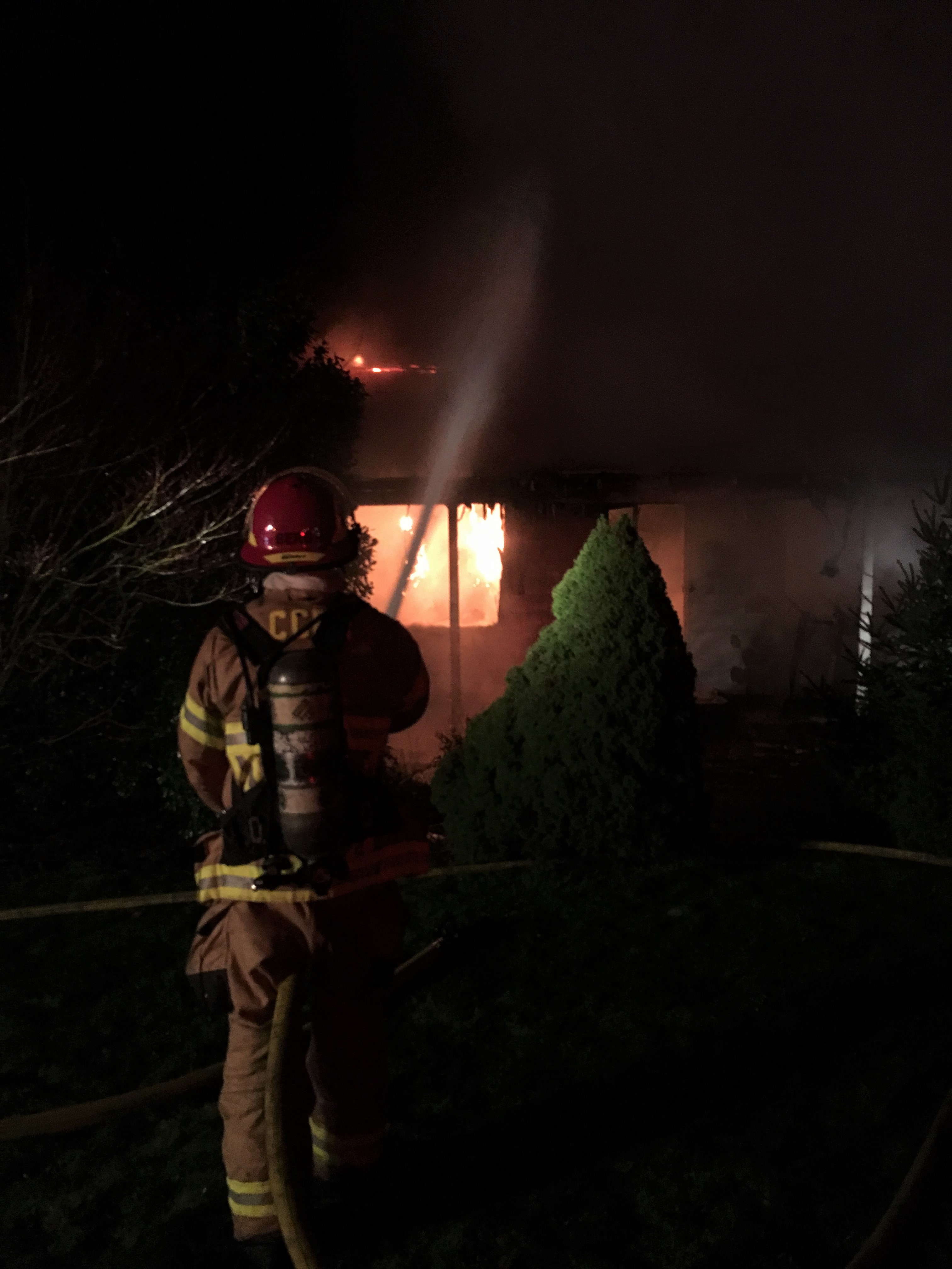 Firefighters used water tenders to bring water to a fire near Ridgefield Monday evening. They attacked it from the yard.