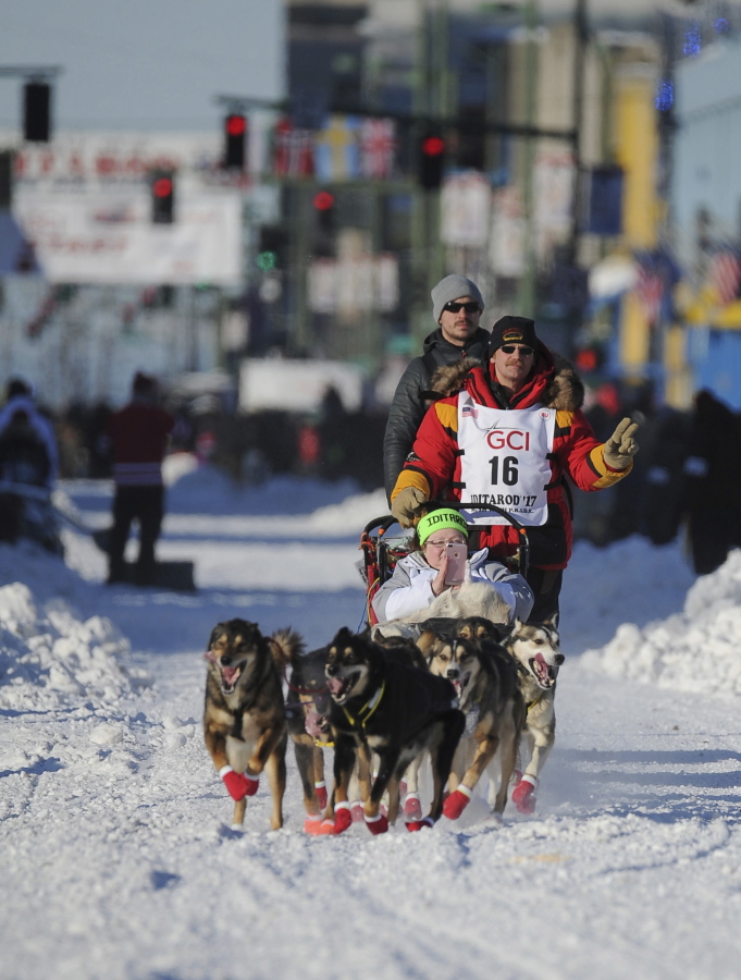 Iditarod veteran Mitch Seavey, of Seward, mushes through downtown during the ceremonial start of the Iditarod Trail Sled Dog Race in Anchorage on March 4.