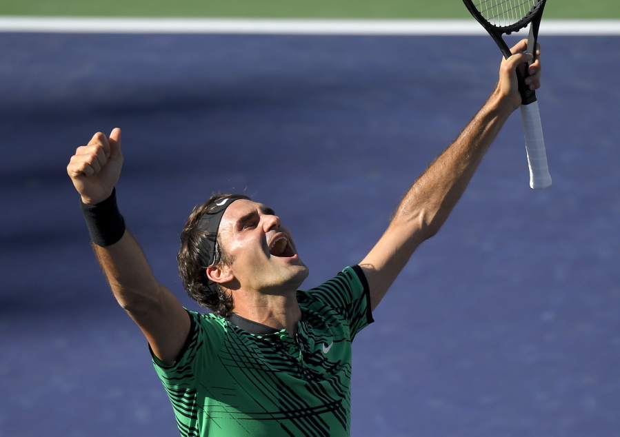 Roger Federer, of Switzerland, celebrates his win against Stan Wawrinka, also of Switzerland, in their final match at the BNP Paribas Open tennis tournament, Sunday, March 19, 2017, in Indian Wells, Calif. (AP Photo/Mark J.