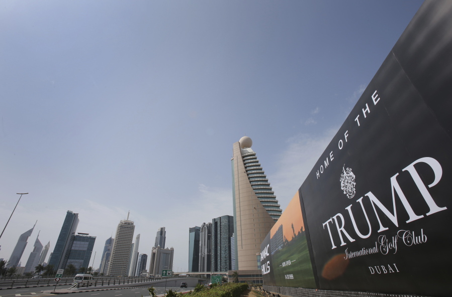 FILE - In this Saturday, Feb. 18, 2017 file photo, a giant billboard advertising the Trump International Golf Club hangs at the Dubai Trade Center roundabout, in Dubai, United Arab Emirates. Donald Trump holds a trademark in Jordan for a casino in his name despite gambling being illegal in the kingdom _ one of four he received in the years before he became America???s president, The Associated Press has learned.