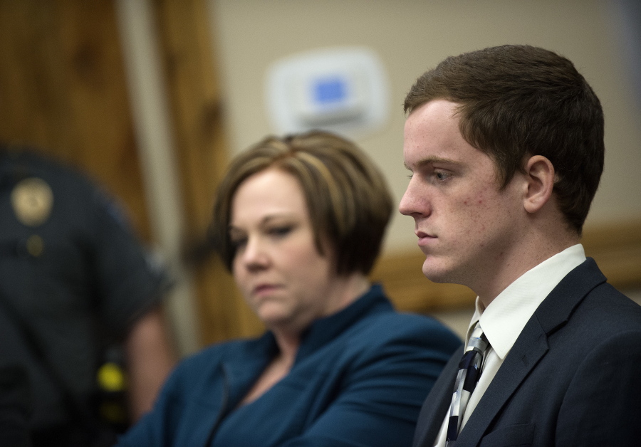 John R.K. Howard stares ahead with a blank face during his sentencing hearing, Friday, Feb. 24, 2017, at the courthouse in Twin Falls, Idaho. District Judge Randy Stoker has sentenced John R.K. Howard, a high school football player to three years of probation and 300 hours of community service after prosecutors said he took part in a brutal locker room assault on a black football player in a small Idaho town.