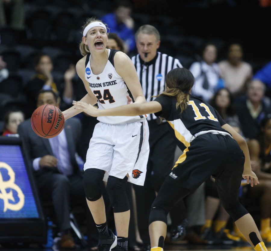 Oregon State&#039;s Sydney Wiese (24) brings the ball upcourt while guarded by Long Beach State&#039;s Martina McCowan (11) during the second half of a first-round game in the women&#039;s NCAA college basketball tournament Friday, March 17, 2017, in Corvallis, Ore. (AP Photo/ Timothy J.