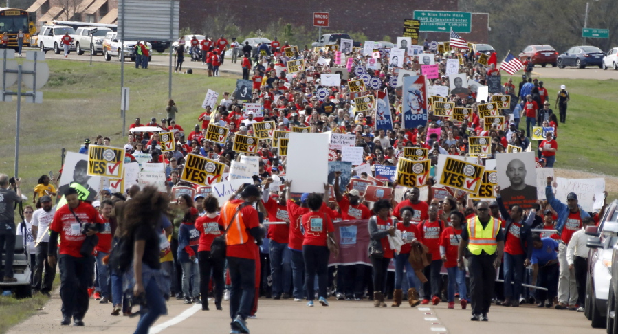 People gather for a pro-union rally Saturday near the Nissan Motor Co. plant in Canton, Miss. (rogelio v.