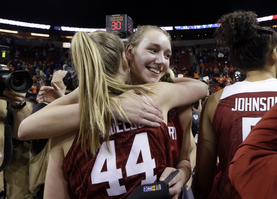 Stanford&#039;s Alanna Smith embraces Karlie Samuelson (44) after the team beat Oregon State in the Pac-12 Tournament championship NCAA college basketball game, Sunday, March 5, 2017, in Seattle. Stanford won 48-43.