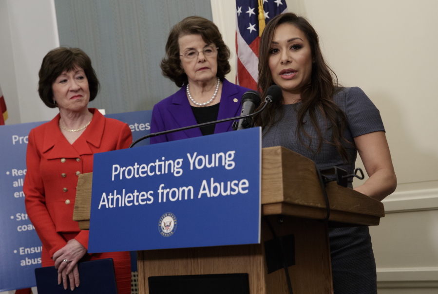 Former Team USA gymnast Jeanette Antolin, right, accompanied by Sen. Susan Collins, R-Maine, left, and Sen. Dianne Feinstein, D-Calif., speaks during a news conference Tuesday on Capitol Hill. (j.