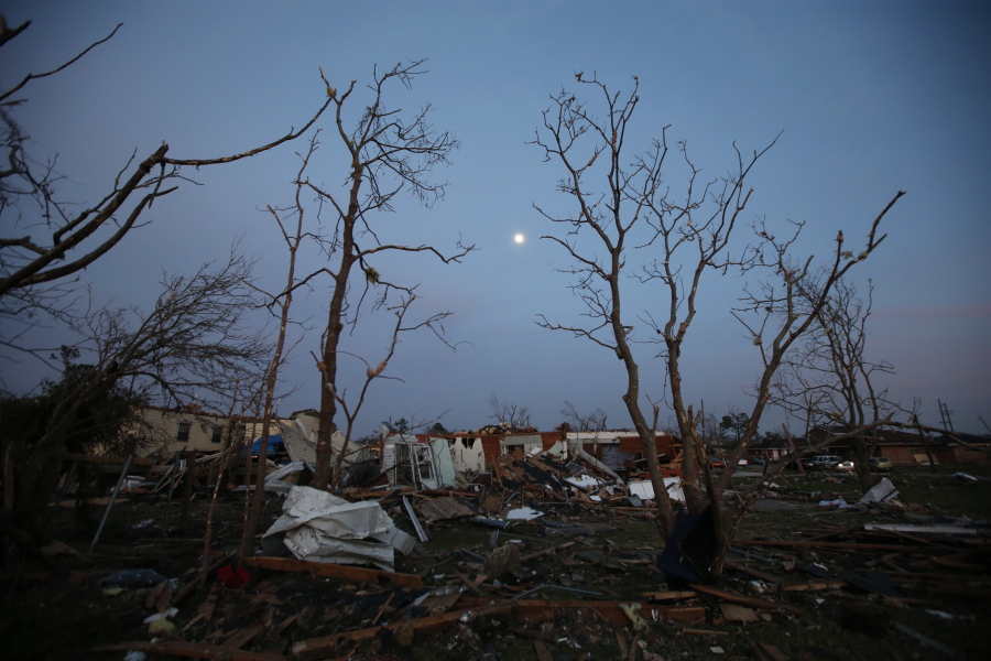 The moon rises over a destroyed neighborhood in the aftermath of a tornado that tore through the New Orleans East section of New Orleans on Feb. 8.  Forecasters are warning of severe storms as a powerful system moves across the central United States, the start of what could a turbulent stretch of spring weather over the next few days. The bull&#039;s-eye for some of the most fearsome weather _ including possible tornadoes, s over parts of Louisiana, Arkansas and east Texas on Friday, March 24 forecasters said.