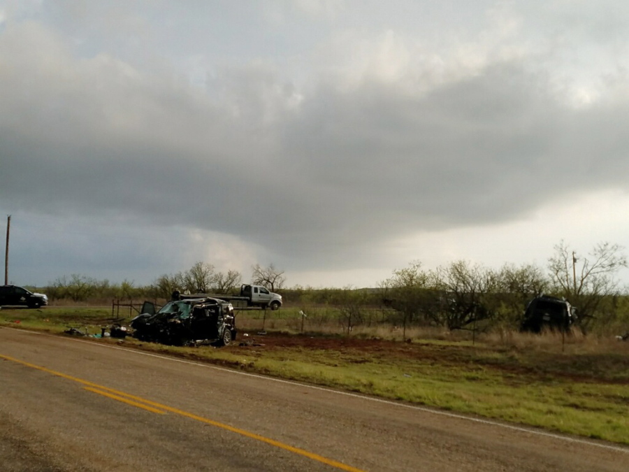 Texas Department of Public Safety troopers investigate a two-vehicle crash that left three storm chasers dead Tuesday near Spur, Texas.