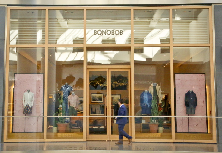 In this Monday, March 20, 2017, photo, a man walks by the Bonobos Guideshop in New York&#039;s Financial District. More shoppers are looking to social media or curated selections for fashion inspiration. That adds to the woes of mall-based stores, as people are already buying fewer clothes, spending online or at discounters when they do, and demanding more personal and convenient ways to buy.