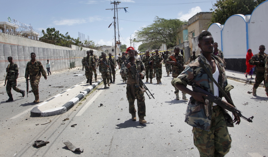 Somali government soldiers patrol Aug. 30, 2016, following a blast near the presidential palace in the capital Mogadishu, Somalia. The Somalia-based Islamic extremist group al-Shabab has proved to be a more resilient foe than expected, forcing the United States to expand its military involvement with the realization that current strategies including drone attacks are not enough, security experts say.