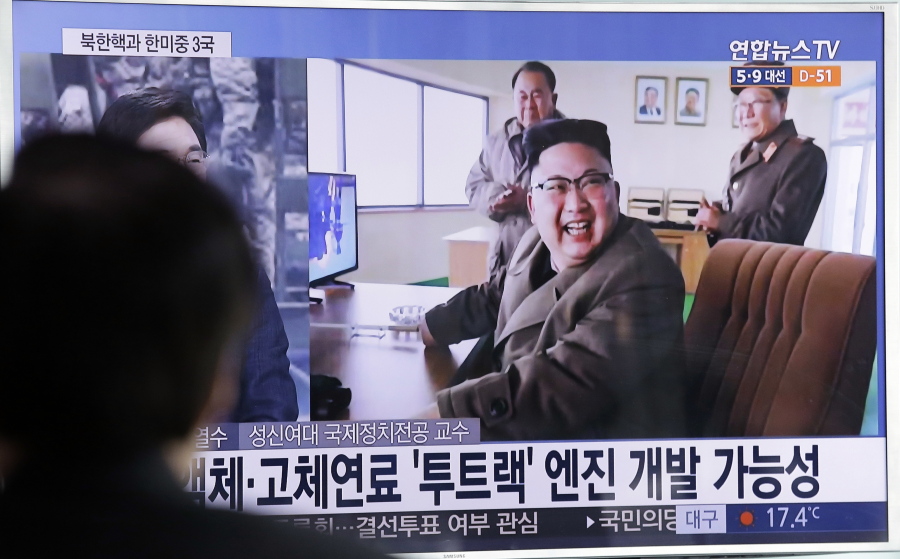 A man watches a TV news program showing an image of North Korea&#039;s leader Kim Jong Un at the country&#039;s Sohae launch site, at Seoul Railway station in Seoul, South Korea, Sunday.