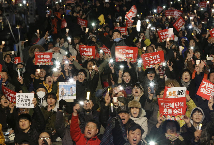 Protesters shout slogans during a rally calling for impeached President Park Geun-hye&#039;s arrest Friday in Seoul, South Korea.