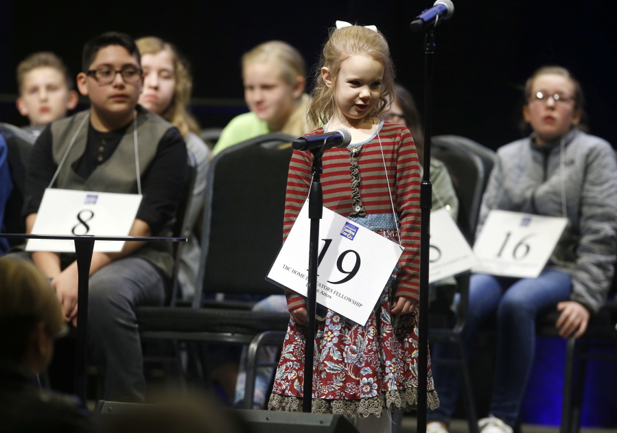 Edith Fuller, 5, spells a word Saturday at the regional spelling bee in Tulsa, Okla.