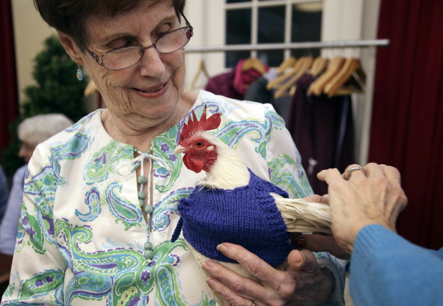 Nancy Kearns, a resident of Fuller Village retirement home, holds Prince Peep.