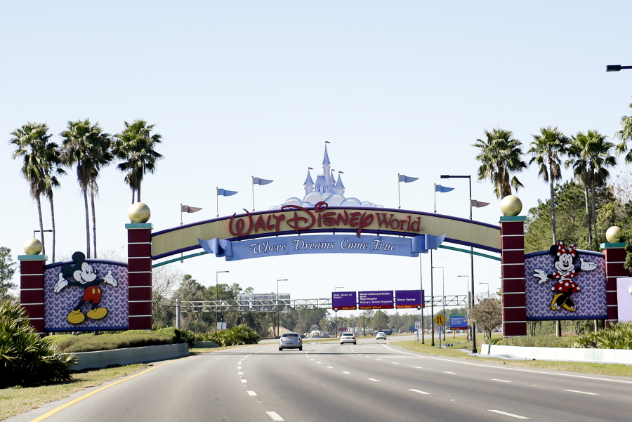 Cars travel to Walt Disney World in Lake Buena Vista, Fla., on Jan. 31. Orlando&#039;s top tourist destinations, including Walt Disney World, SeaWorld and Universal Orlando, are in legal battles about how much they&#039;re worth with the local property appraiser and tax collector.