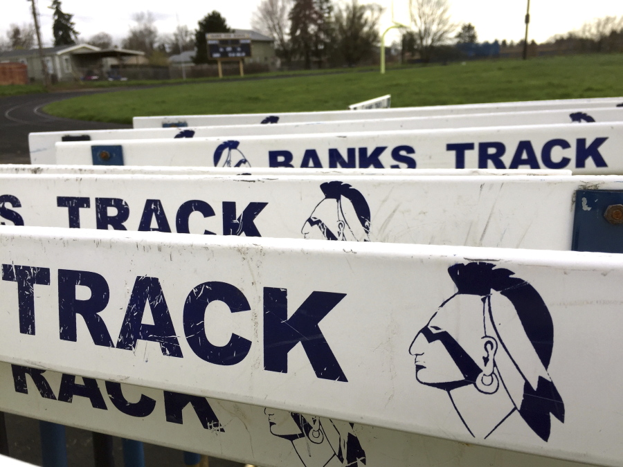 The Banks High School mascot is visible on track hurdles at the school in Banks, Ore., on March 23. In Oregon, school districts with Native American mascots must abandon them or strike a deal with the tribe by July 1 or risk punishment that could include the withholding of state funds.