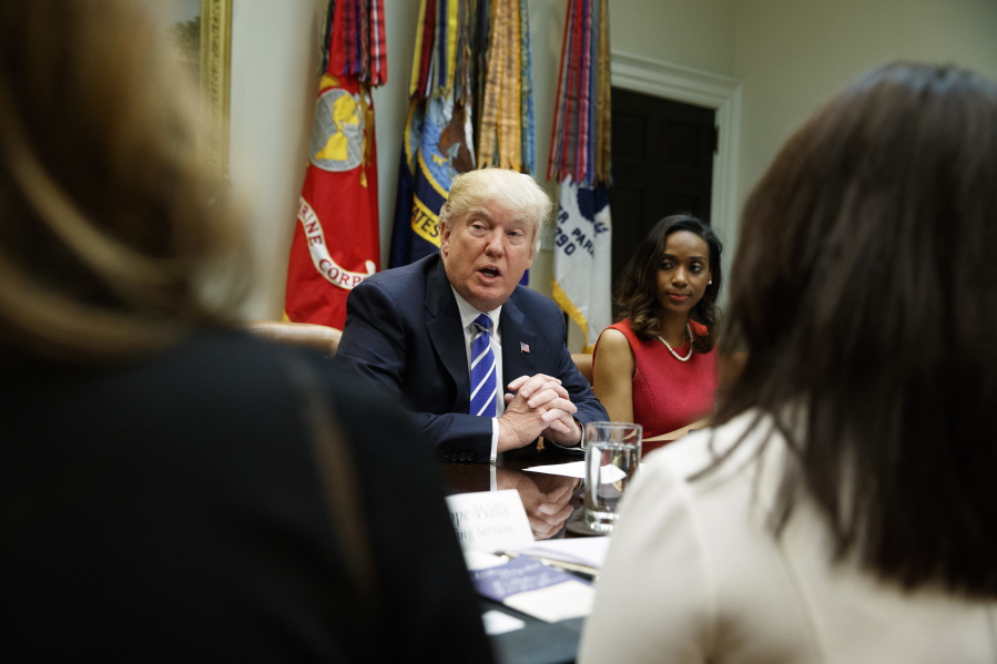 President Donald Trump, joined by Jessica Johnson, right, speaks during a meeting with women small business owners in the Roosevelt Room of the White House in Washington.