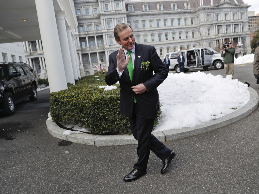 Irish Prime Minister Enda Kenny waves as he walks to his vehicle after speaking to members of the media outside the West Wing of the White House in Washington, Thursday, March 16, 2017, following his meeting with President Donald Trump.