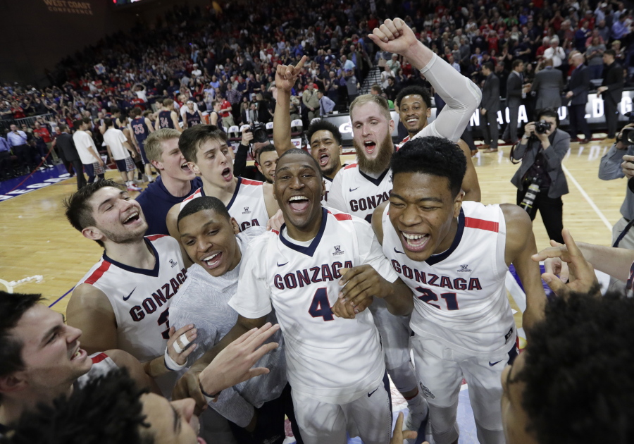 Gonzaga players celebrate after defeating Saint Mary&#039;s in an NCAA college basketball game during the championship of the West Coast Conference tournament, Tuesday, March 7, 2017, in Las Vegas. Gonzaga won 74-56.